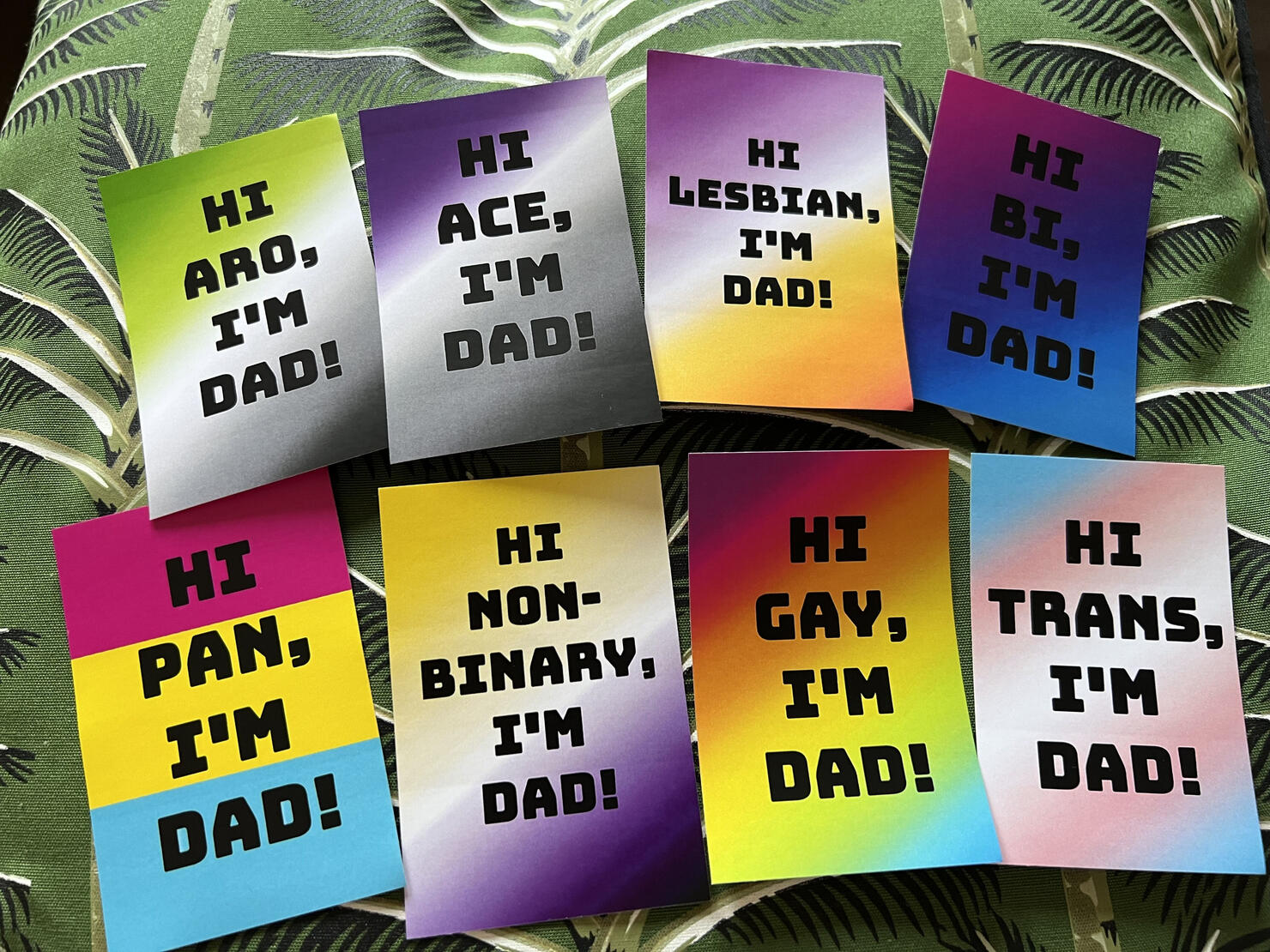 A series of eight images, featuring the phrase "Hi [X}, I'm Dad!" with eight different LGBTQIA+ identities.